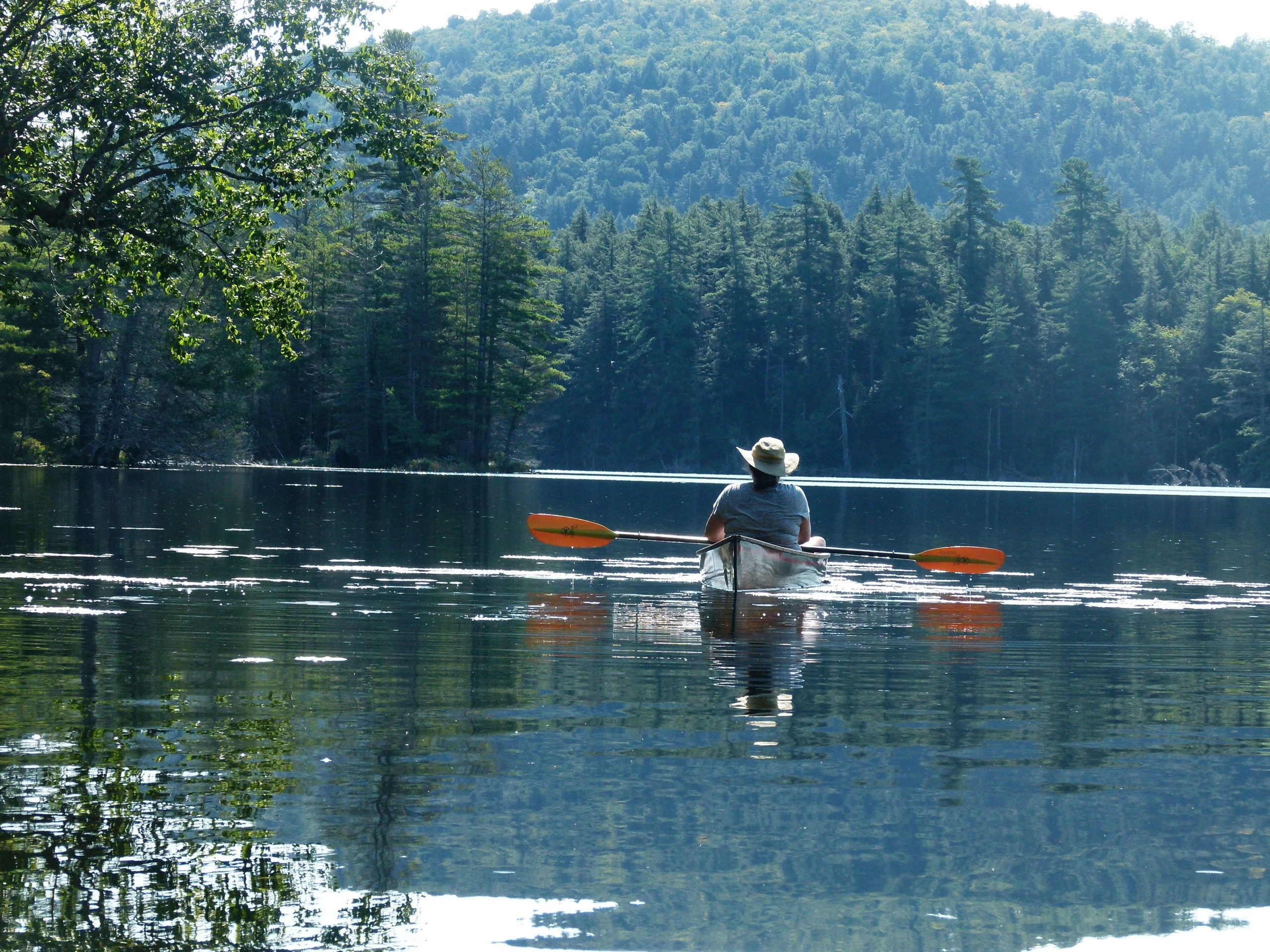 photo of woman in kayak